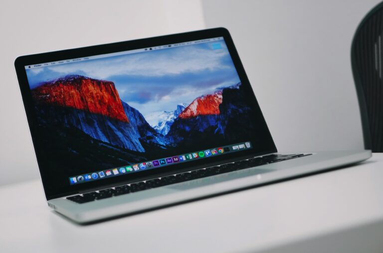 An open laptop photographed from above on a plain surface