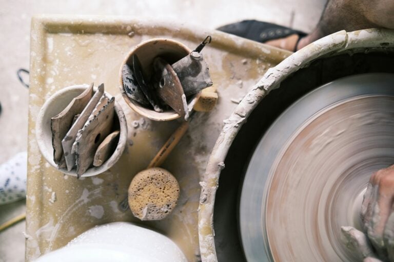 Handmade pottery being shaped by hand