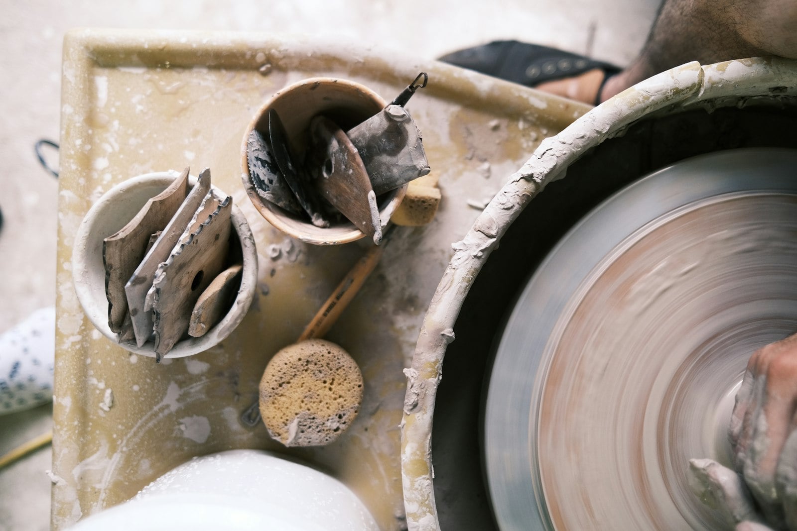 Handmade pottery being shaped by hand