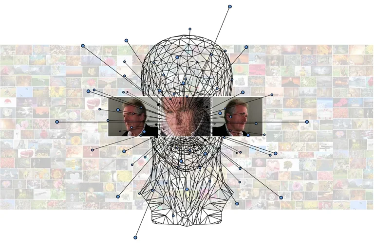 A wireframe model of a human head overlaid with facial recognition lines in front of a wall of small photographs